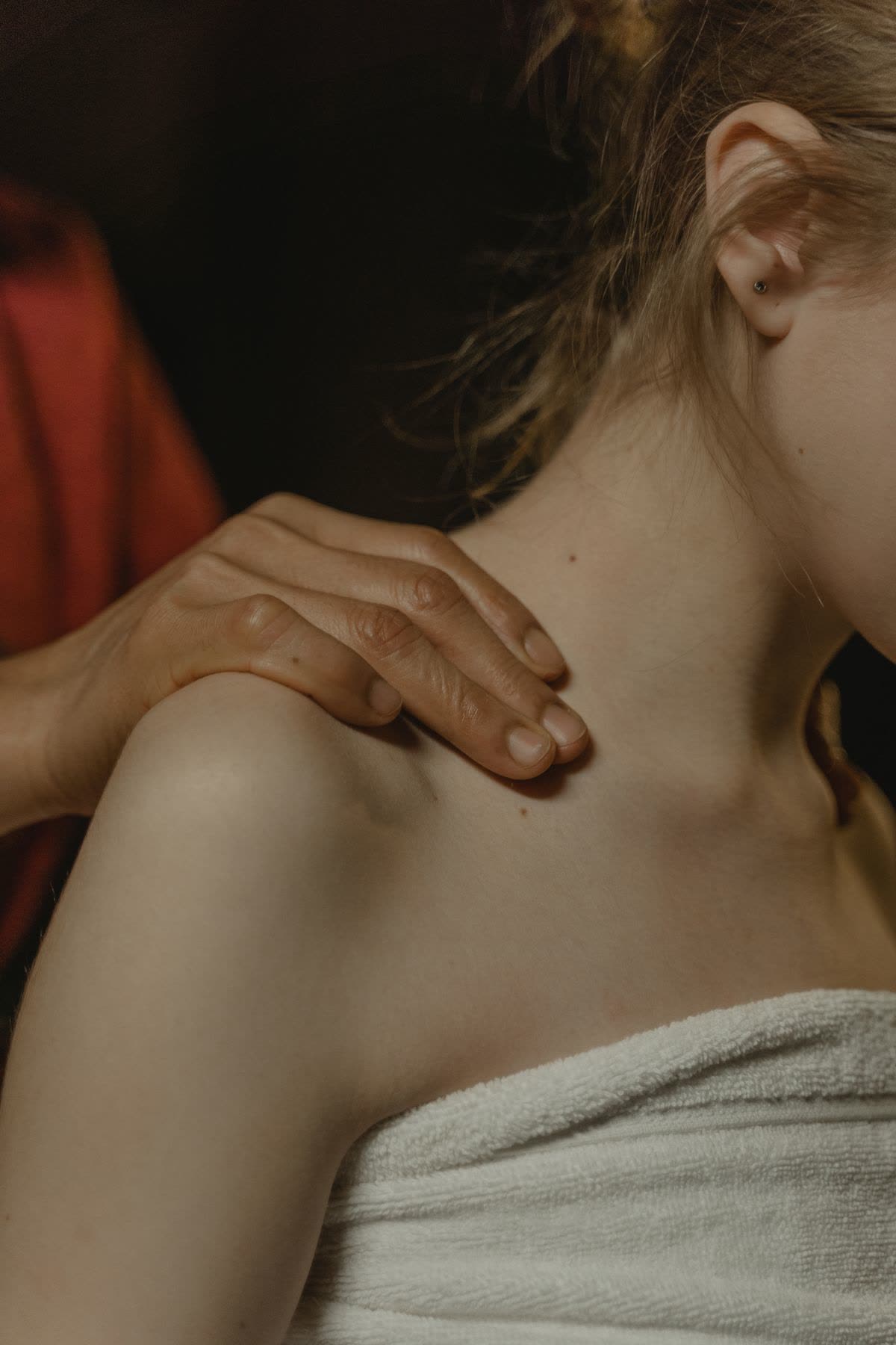 Deep tissue shoulder massage with firm pressure at a professional spa
